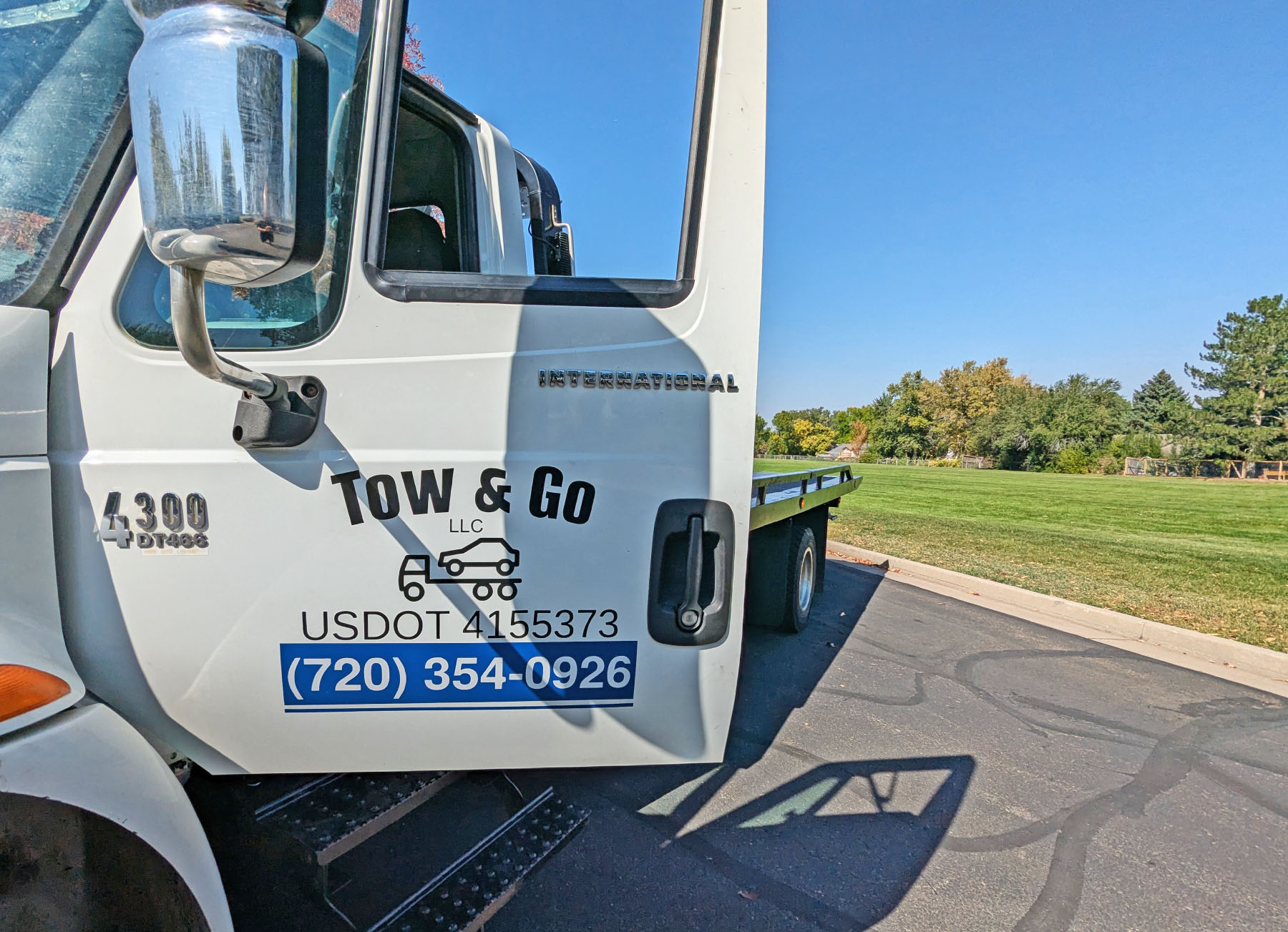 Another view of the door with the company logo on the tow truck